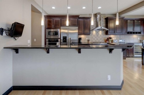 168 Sunset View, Cochrane, AB - Indoor Photo Showing Kitchen With Upgraded Kitchen