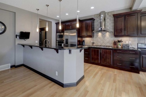168 Sunset View, Cochrane, AB - Indoor Photo Showing Kitchen With Upgraded Kitchen