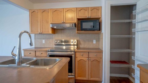 160 Covemeadow Road Ne, Calgary, AB - Indoor Photo Showing Kitchen With Double Sink