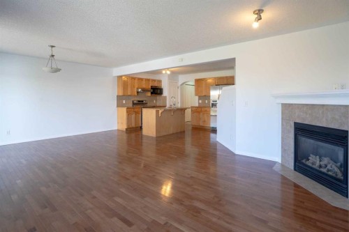 160 Covemeadow Road Ne, Calgary, AB - Indoor Photo Showing Other Room With Fireplace