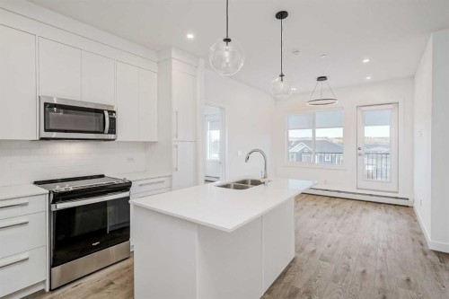 4307-111 Wolf Creek Drive Se, Calgary, AB - Indoor Photo Showing Kitchen With Double Sink With Upgraded Kitchen