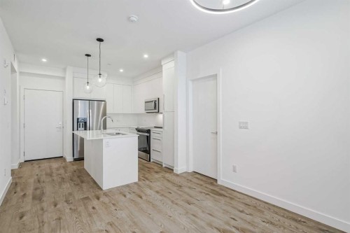 4307-111 Wolf Creek Drive Se, Calgary, AB - Indoor Photo Showing Kitchen With Upgraded Kitchen