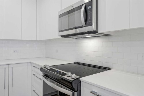 4307-111 Wolf Creek Drive Se, Calgary, AB - Indoor Photo Showing Kitchen With Upgraded Kitchen