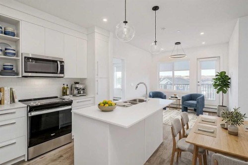 4307-111 Wolf Creek Drive Se, Calgary, AB - Indoor Photo Showing Kitchen With Double Sink With Upgraded Kitchen