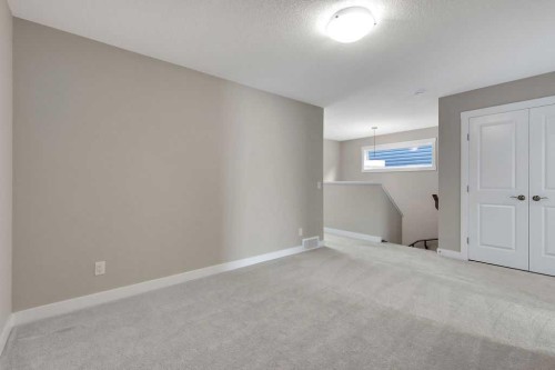 216 Creekstone Row Sw, Calgary, AB - Indoor Photo Showing Other Room