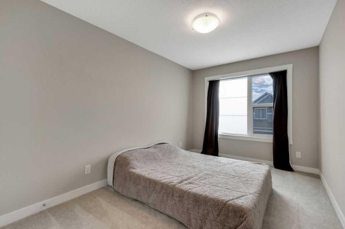 216 Creekstone Row Sw, Calgary, AB - Indoor Photo Showing Bedroom