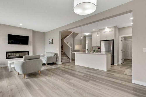 216 Creekstone Row Sw, Calgary, AB - Indoor With Fireplace