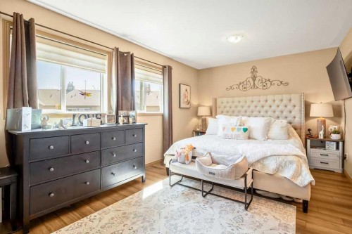 49 Spring Meadows Bay, Okotoks, AB - Indoor Photo Showing Bedroom
