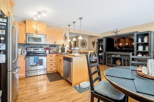 49 Spring Meadows Bay, Okotoks, AB - Indoor Photo Showing Kitchen With Stainless Steel Kitchen