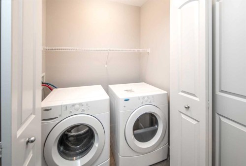 50 Everwoods Park Sw, Calgary, AB - Indoor Photo Showing Laundry Room