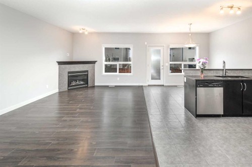 50 Everwoods Park Sw, Calgary, AB - Indoor Photo Showing Living Room With Fireplace