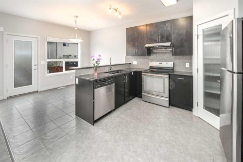 50 Everwoods Park Sw, Calgary, AB - Indoor Photo Showing Kitchen With Double Sink