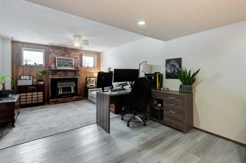 1204 Ranchlands Boulevard Nw, Calgary, AB - Indoor Photo Showing Office With Fireplace