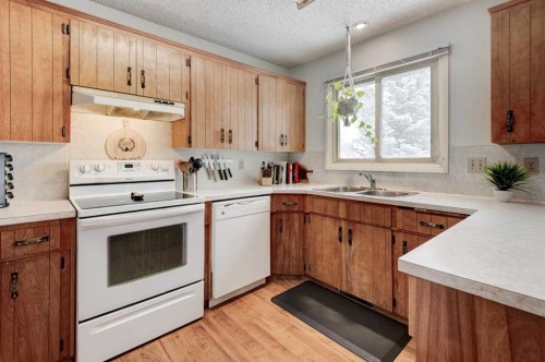 1204 Ranchlands Boulevard Nw, Calgary, AB - Indoor Photo Showing Kitchen With Double Sink