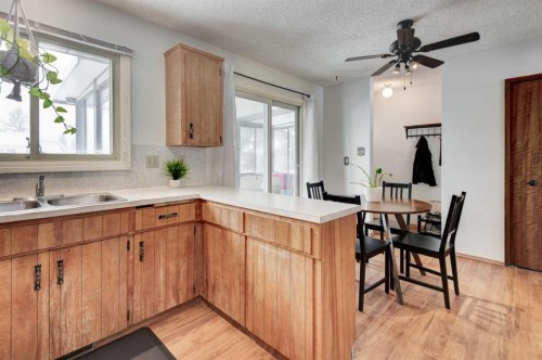 1204 Ranchlands Boulevard Nw, Calgary, AB - Indoor Photo Showing Kitchen With Double Sink