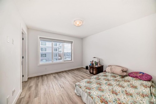 339 Wolf Creek Way Se, Calgary, AB - Indoor Photo Showing Bedroom