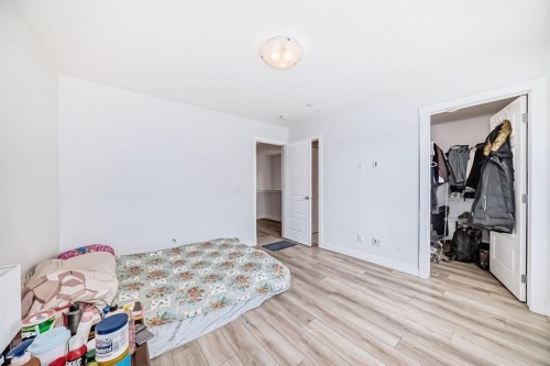 339 Wolf Creek Way Se, Calgary, AB - Indoor Photo Showing Bedroom