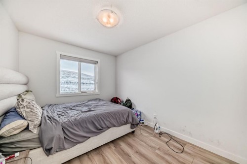 339 Wolf Creek Way Se, Calgary, AB - Indoor Photo Showing Bedroom