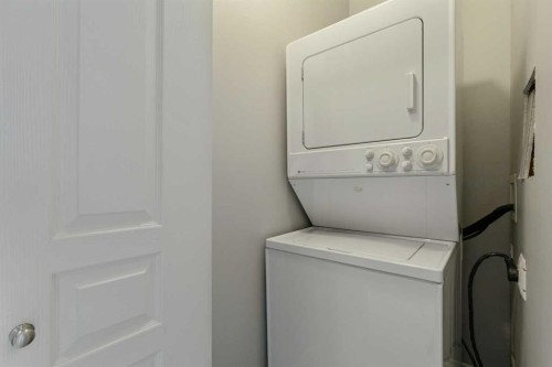 14-133 Rockyledge View Nw, Calgary, AB - Indoor Photo Showing Laundry Room