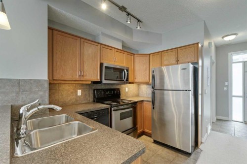 14-133 Rockyledge View Nw, Calgary, AB - Indoor Photo Showing Kitchen With Stainless Steel Kitchen With Double Sink