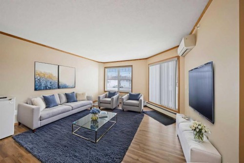 310-11 Somervale View Sw, Calgary, AB - Indoor Photo Showing Living Room
