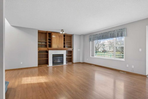 416 Douglas Glen Close Se, Calgary, AB - Indoor Photo Showing Living Room With Fireplace
