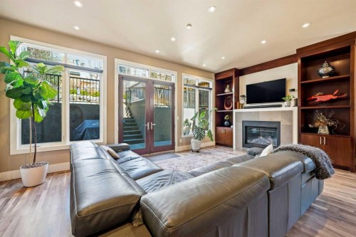 3610 8 Avenue Nw, Calgary, AB - Indoor Photo Showing Living Room With Fireplace
