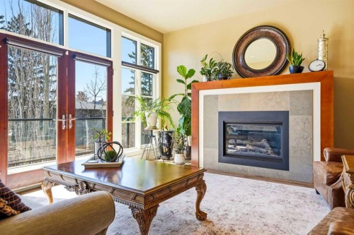 3610 8 Avenue Nw, Calgary, AB - Indoor Photo Showing Living Room With Fireplace