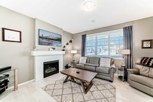 236 Sundown Road, Cochrane, AB - Indoor Photo Showing Living Room With Fireplace