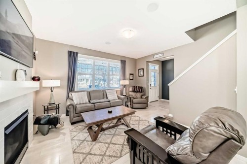 236 Sundown Road, Cochrane, AB - Indoor Photo Showing Living Room With Fireplace