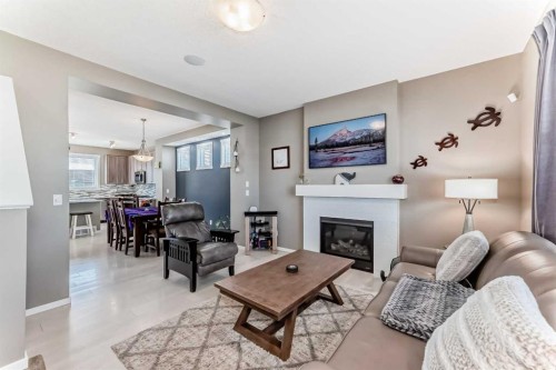 236 Sundown Road, Cochrane, AB - Indoor Photo Showing Living Room With Fireplace