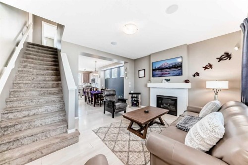 236 Sundown Road, Cochrane, AB - Indoor Photo Showing Living Room With Fireplace