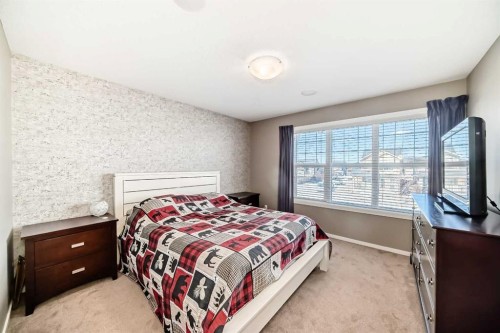 236 Sundown Road, Cochrane, AB - Indoor Photo Showing Bedroom