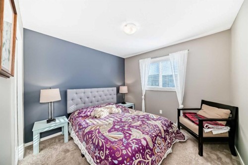 236 Sundown Road, Cochrane, AB - Indoor Photo Showing Bedroom