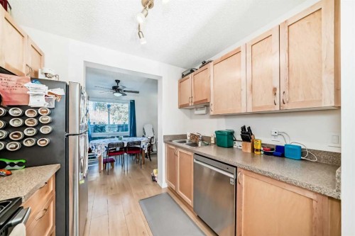 97-6915 Ranchview Drive Nw, Calgary, AB - Indoor Photo Showing Kitchen With Double Sink