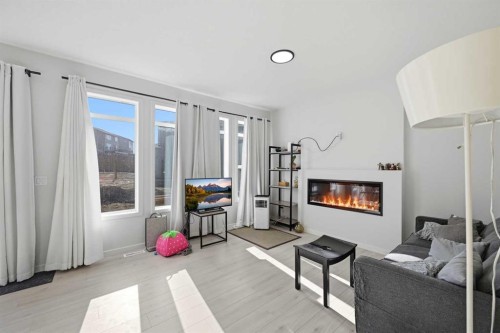 191 Herron Rise Ne, Calgary, AB - Indoor Photo Showing Living Room With Fireplace