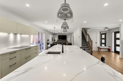 75 Woodacres Crescent Sw, Calgary, AB - Indoor Photo Showing Kitchen With Double Sink With Upgraded Kitchen