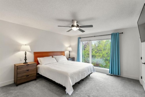 75 Woodacres Crescent Sw, Calgary, AB - Indoor Photo Showing Bedroom