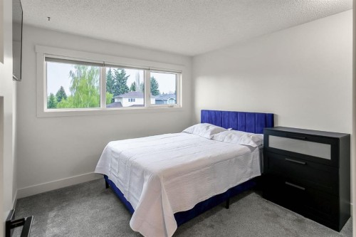 75 Woodacres Crescent Sw, Calgary, AB - Indoor Photo Showing Bedroom