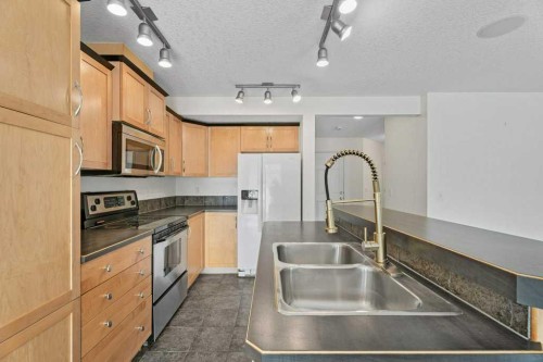 2317 Eversyde Avenue Sw, Calgary, AB - Indoor Photo Showing Kitchen With Double Sink