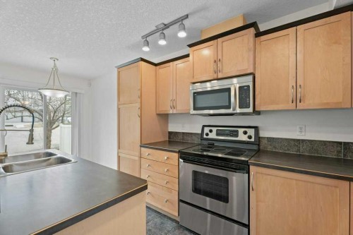2317 Eversyde Avenue Sw, Calgary, AB - Indoor Photo Showing Kitchen With Double Sink