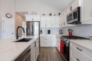 511 Kingsmere Way Se, Airdrie, AB  - Indoor Photo Showing Kitchen With Double Sink With Upgraded Kitchen 