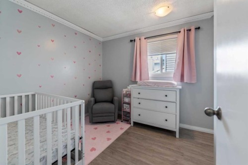 15 Erin Green Way Se, Calgary, AB - Indoor Photo Showing Bedroom