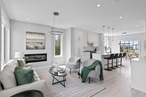 501-8155 8 Avenue Sw, Calgary, AB - Indoor Photo Showing Living Room With Fireplace