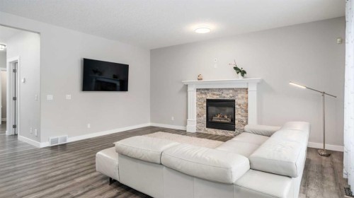 39 Mt Douglas Point Se, Calgary, AB - Indoor Photo Showing Living Room With Fireplace