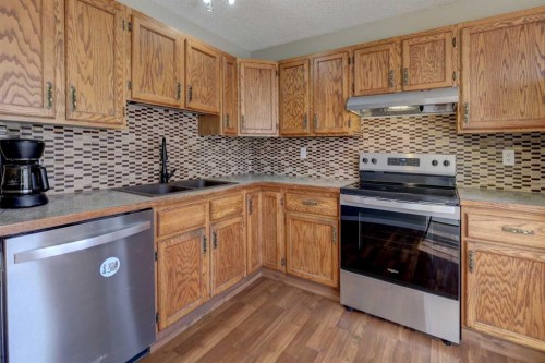 107 Macewan Park Way Nw, Calgary, AB - Indoor Photo Showing Kitchen With Double Sink