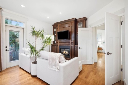 108 Posthill Drive Sw, Calgary, AB - Indoor Photo Showing Living Room With Fireplace