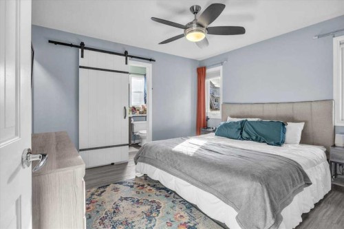 301 Mcleod Crescent, Diamond Valley, AB - Indoor Photo Showing Bedroom