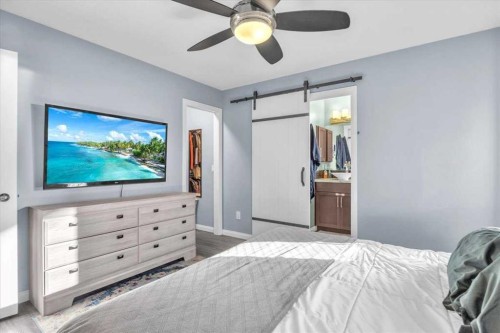 301 Mcleod Crescent, Diamond Valley, AB - Indoor Photo Showing Bedroom