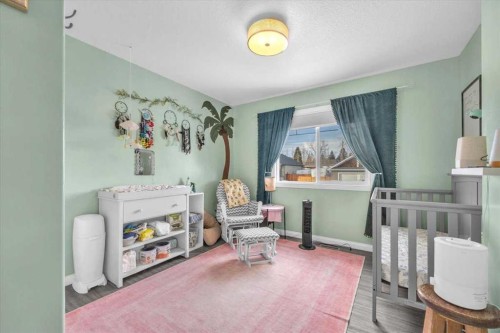 301 Mcleod Crescent, Diamond Valley, AB - Indoor Photo Showing Bedroom